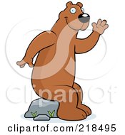 Poster, Art Print Of Friendly Bear Sitting On A Rock And Waving