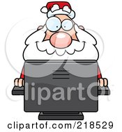 Plump Santa Using A Desktop Computer