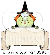 Poster, Art Print Of Plump Green Witch Looking Over A Blank Banner