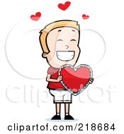 Poster, Art Print Of Happy Blond Boy Holding A Heart Valentine