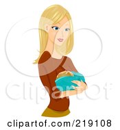 Pretty Blond Woman Holding A Baby