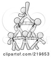 Poster, Art Print Of Group Of White Businessmen Piling Up To Form A Pyramid
