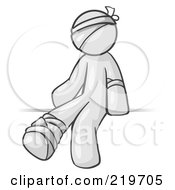 Injured White Man Sitting In The Emergency Room After Being Bandaged Up On The Head Arm And Ankle Following An Accident Clipart Graphic