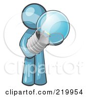 Royalty Free RF Clipart Illustration Of A Denim Blue Man Holding A Glass Electric Lightbulb Symbolizing Utilities Or Ideas