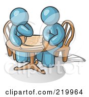 Poster, Art Print Of Two Denim Blue Businessmen Sitting At A Table Discussing Papers