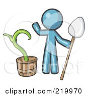 Denim Blue Man Holding A Shovel By A Potted Plant