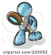 Denim Blue Man Bending Over To Inspect Something Through A Magnifying Glass