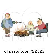 White Family With Two Parents And An Only Child A Boy Roasting Marshmallows Over A Camp Fire While Camping