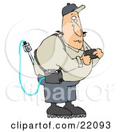 White Man Reading A Gas Detector Pager While Working On The Job