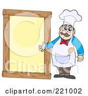 Poster, Art Print Of Male Chef Standing And Presenting A Blank Yellow Framed Sign