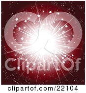 Christmas Background Of A Bright Burst Of Light With Stars And Sparkles Over A Gradient Red
