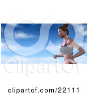 Healthy And Fit Caucasian Woman With Her Hair Tied Up Running In A Sports Bra Against A Blue Cloudy Sky