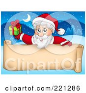 Santa Holding A Gift Over A Blank Parchment Scroll Banner Against A Winter Landscape