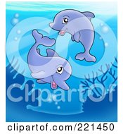 Royalty Free RF Clipart Illustration Of A Cute Dolphin Pair Swimming Near A Reef