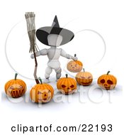 White Character Wearing A Black Witch Hat And Carrying A Broomstick Standing With Carved Halloween Pumpkins