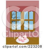 Plate Of Cupcakes Near A Window With A Winter Scene