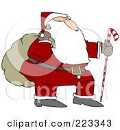 Santa Trekking With A Candy Cane Stick And Carrying A Sack On His Shoulder