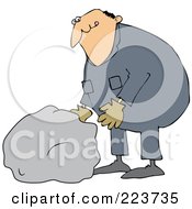 Caucasian Worker Man Moving A Large Rock
