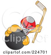 Rocket Mascot Cartoon Character Grabbing A Hockey Puck