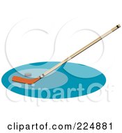 Royalty Free RF Clipart Illustration Of A Hockey Stick And Puck On A Blue Oval