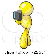 Clipart Illustration Of A Yellow Man Character Tourist Or Photographer Taking Pictures With A Camera