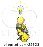 Smart Yellow Man Seated With His Legs Crossed Brainstorming And Writing Ideas Down In A Notebook Lightbulb Over His Head