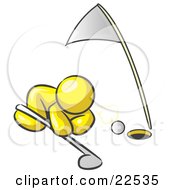 Clipart Illustration Of A Yellow Man Down On The Ground Trying To Blow A Golf Ball Into The Hole by Leo Blanchette