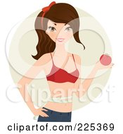 Pretty Fit Brunette Woman In A Bra Holding An Apple And Standing With Measuring Tape Around Her Waist Over A Beige Circle