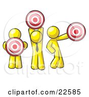 Group Of Three Yellow Men Holding Red Targets In Different Positions