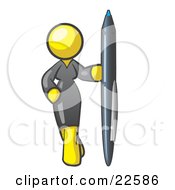Yellow Woman In A Gray Dress Standing With One Hand On Her Hip Holding A Huge Pen