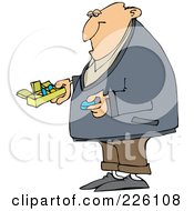 Man Holding A Blue Pill And A Daily Organizer