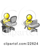 Two Yellow Men Employees Working On Computers In An Office One Using A Desktop The Other Using A Laptop