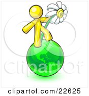 Yellow Man Standing On The Green Planet Earth And Holding A White Daisy Symbolizing Organics And Going Green For A Healthy Environment