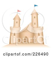 Sand Castle With Flags On The Turrets