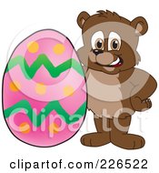 Royalty Free RF Clipart Illustration Of A Bear Cub School Mascot With An Easter Egg