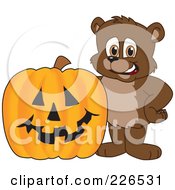 Royalty Free RF Clipart Illustration Of A Bear Cub School Mascot By A Halloween Pumpkin