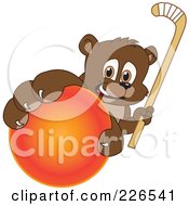 Poster, Art Print Of Bear Cub School Mascot Grabbing A Hockey Ball And Holding A Stick