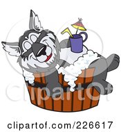 Husky School Mascot Bathing In A Barrel With A Drink On His Belly
