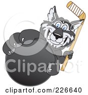 Husky School Mascot Grabbing A Hockey Puck