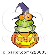 Poster, Art Print Of Spotted Frog Wearing A Witch Hat And Sitting On A Jackolantern