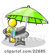 Clipart Illustration Of A Traveling Yellow Business Man Sitting Under An Umbrella At A Table Using A Laptop Computer