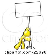 Poster, Art Print Of Strong Yellow Man Pushing A Blank Sign Upright