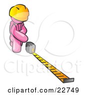 Pink Man Contractor Wearing A Hardhat Kneeling And Measuring