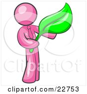 Clipart Illustration Of A Pink Man Holding A Green Leaf Symbolizing Gardening Landscaping Or Organic Products