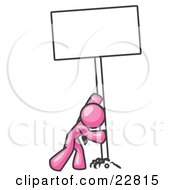 Clipart Illustration Of A Strong Pink Man Pushing A Blank Sign Upright