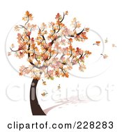Poster, Art Print Of Tree With Fall Foliage And Leaves Blowing Off In The Breeze