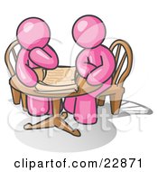 Two Pink Businessmen Sitting At A Table Discussing Papers