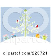 Winter Robins On A Christmas Tree On A Hill Over Presents Against Blue