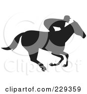 Poster, Art Print Of Profile View Of A Jockey Racing A Horse
