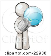 White Man Holding A Glass Electric Lightbulb Symbolizing Utilities Or Ideas